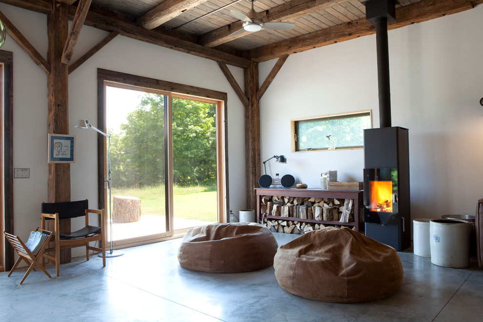 Pacific Energy Wood Stove for Rustic Living Room with Exposed Beams