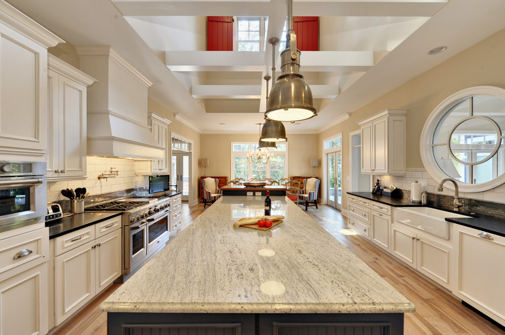 Quartzite vs Granite for Beach Style Kitchen with Window Above Sink