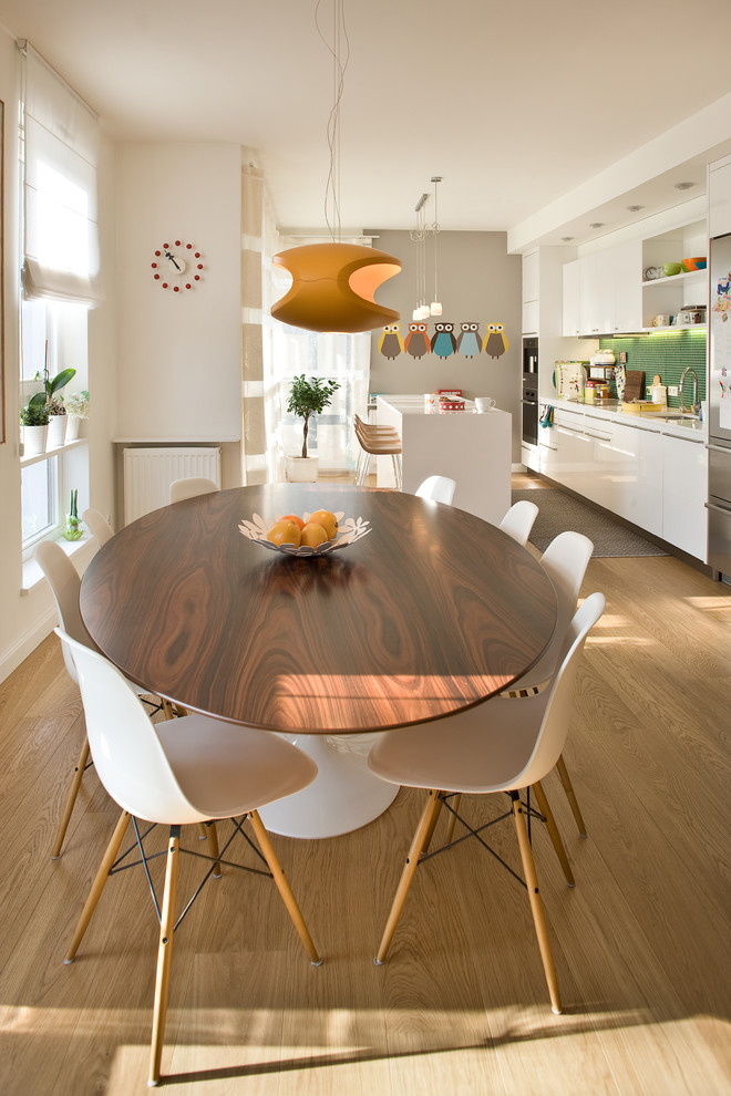 54 Round Pedestal Dining Table Dining Room Contemporary with Eames Chair Orange Pendant