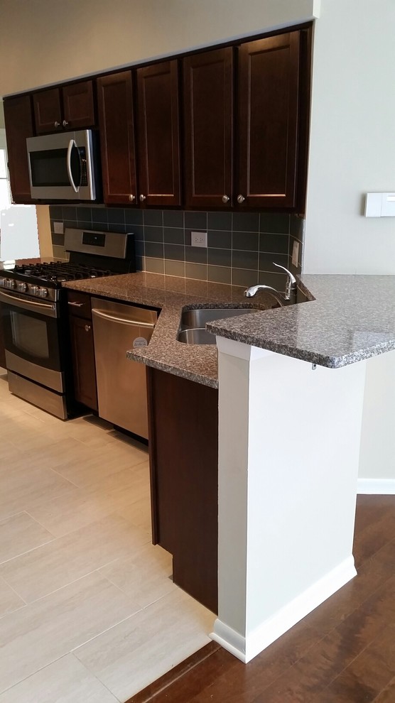 bainbrook brown granite Kitchen Contemporary with contemporary glass backsplash granite