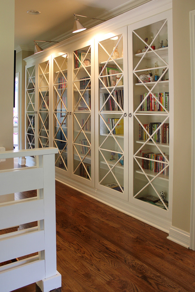Bookcases with Glass Doors Family Room Transitional with Accent Lighting Baseboard Beige