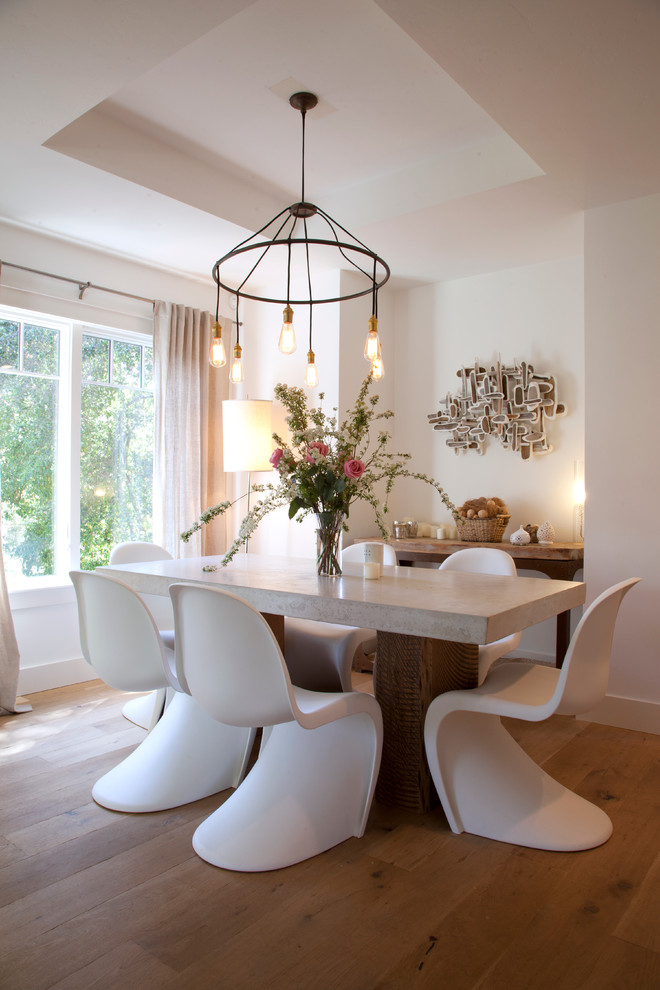 Concrete Dining Table Dining Room Contemporary with Artwork Beige Curtains Chandelier