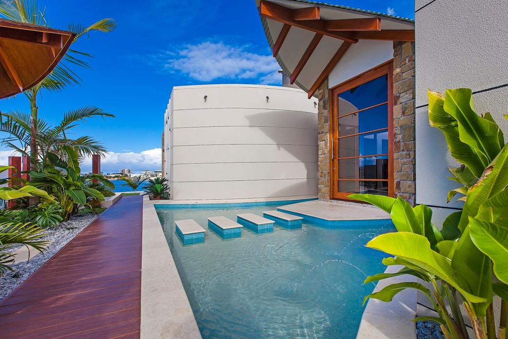 Concrete Stepping Stones Entry Tropical with Blue Mosaic Tile Pool