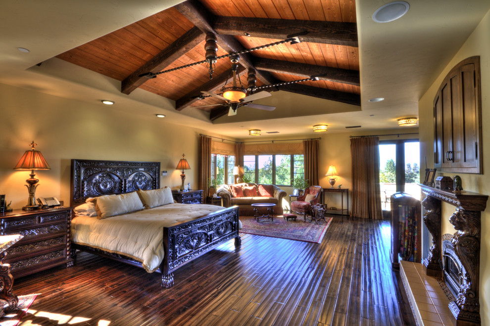 Coral and Green Bedding Bedroom Mediterranean with Exposed Beams Fireplace Mantel