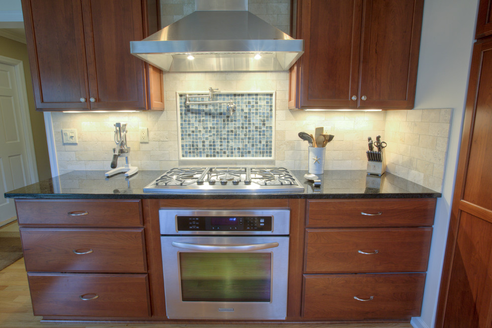 Cracked Glass Tile Kitchen with Black Granite Countertops Built In