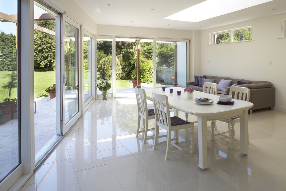 Crema Marfil Porcelain Tile Dining Room Contemporary with Clerestory Windows Dining Table