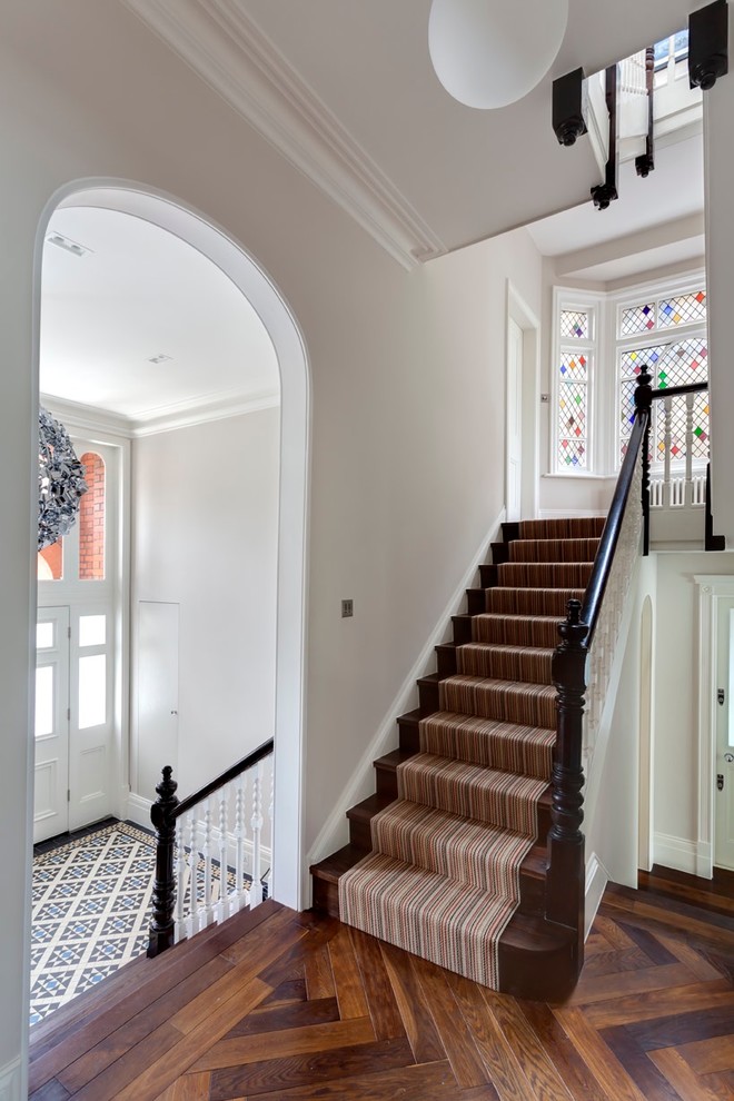 Diamond Paned Windows Staircase Traditional with Dark Wood Banister Dark