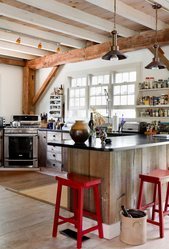 Distressed Wood Cabinets Kitchen Eclectic with Black Coutertop Corner Oven