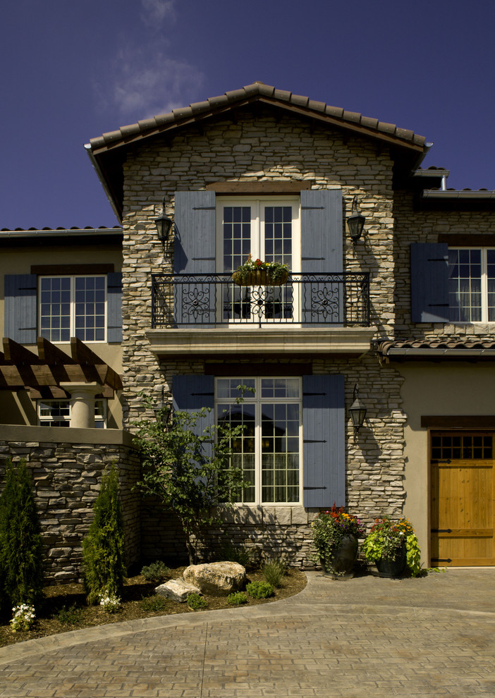 French Door Shutters Exterior Mediterranean with Balcony Boulders Driveway Lanterns