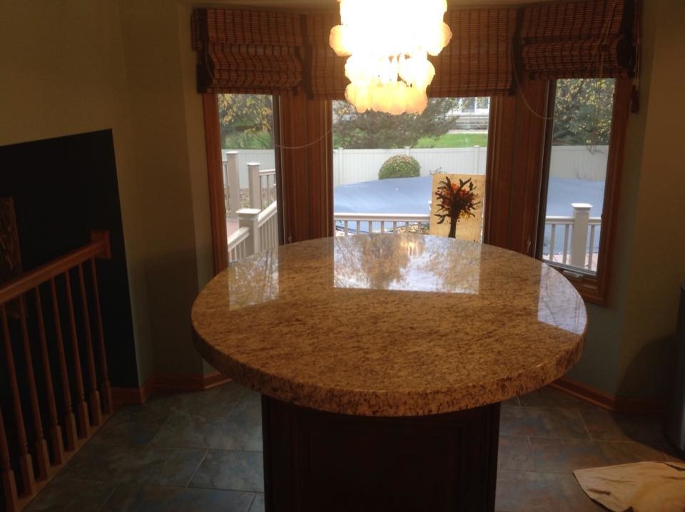 Giallo Ornamental Light Granite Kitchen with Cabinetry Dark Wood Cabinetry1