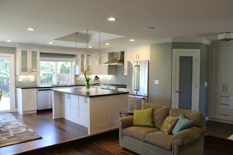 Glass Front Refrigerator Kitchen Transitional with Black Countertops Ceiling Height