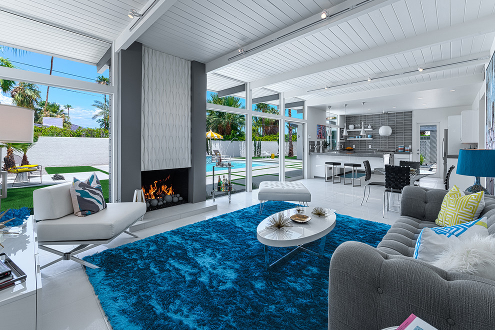 Gray Tufted Sofa Living Room Midcentury with Bright Blue Area Rug