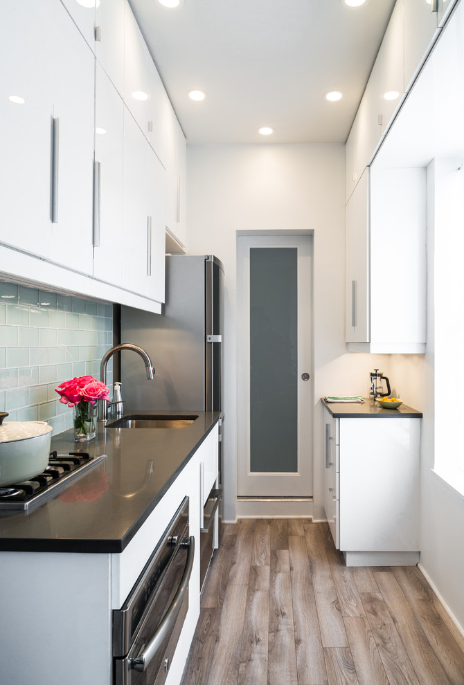 Green Glass Subway Tile Backsplash Kitchen Contemporary with Black Countertop Narrow Door