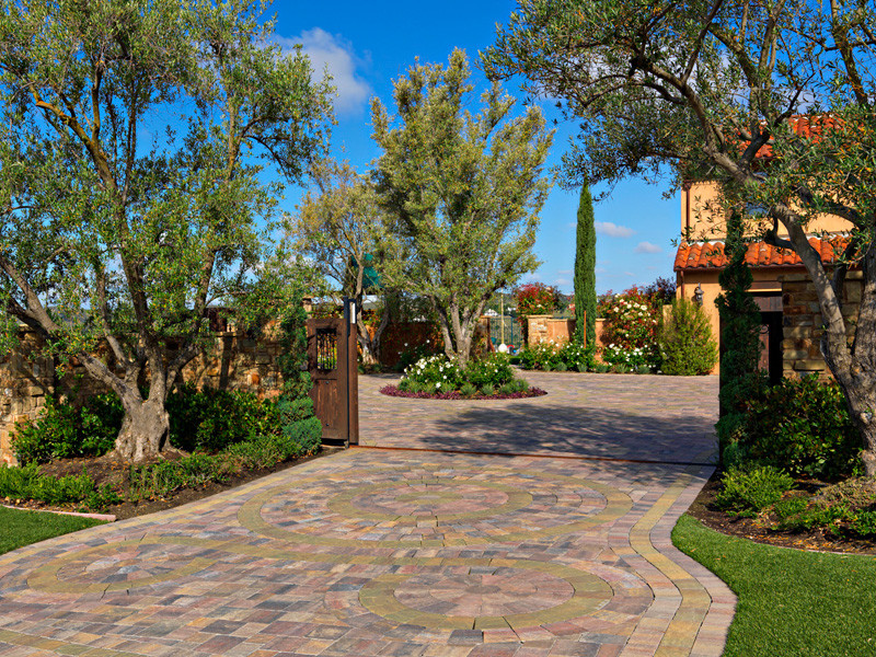 Green Tin Roof Exterior Mediterranean with Beautiful Entryway Brick Driveway