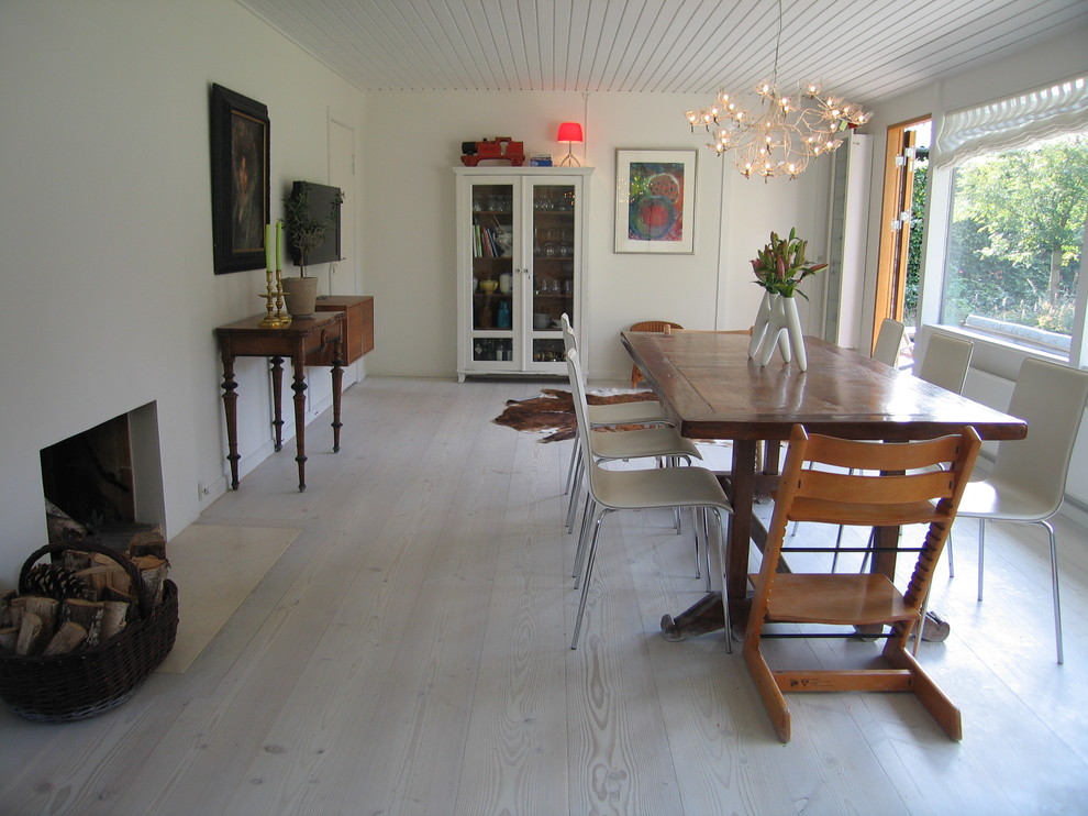 Grey Wood Flooring Dining Room Contemporary with Armoire Ceiling Treatment Centerpiece