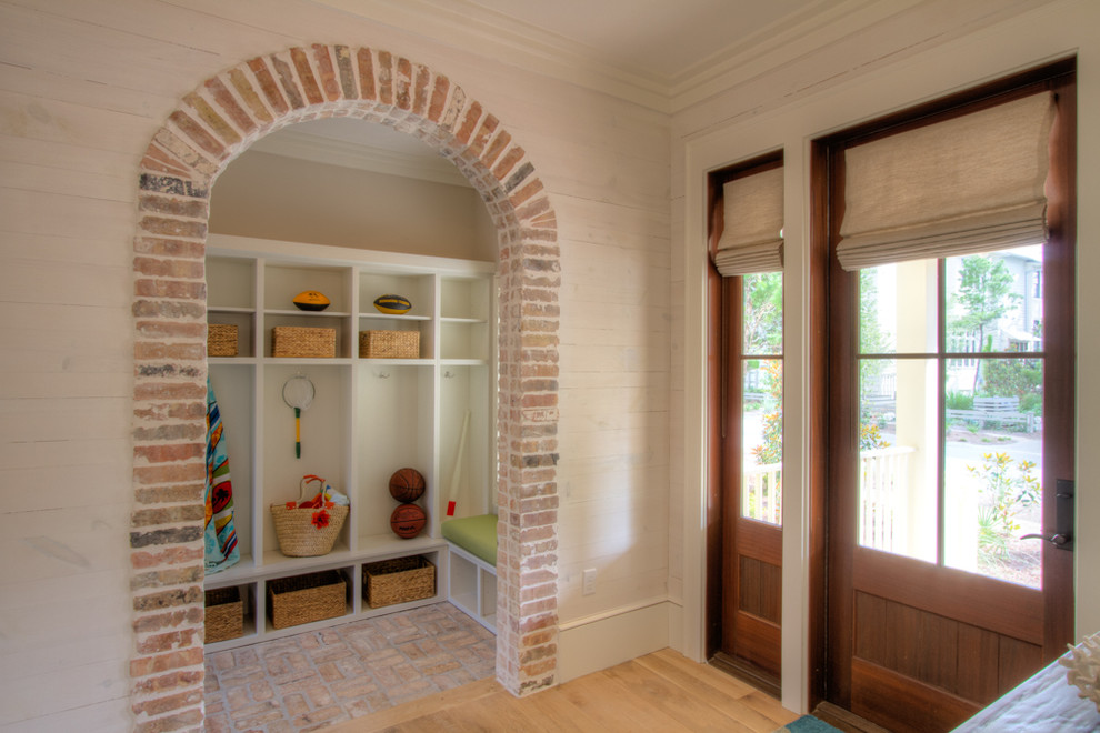 Interior Brick Flooring Entry Beach with Arched Doorway Architectural Iron