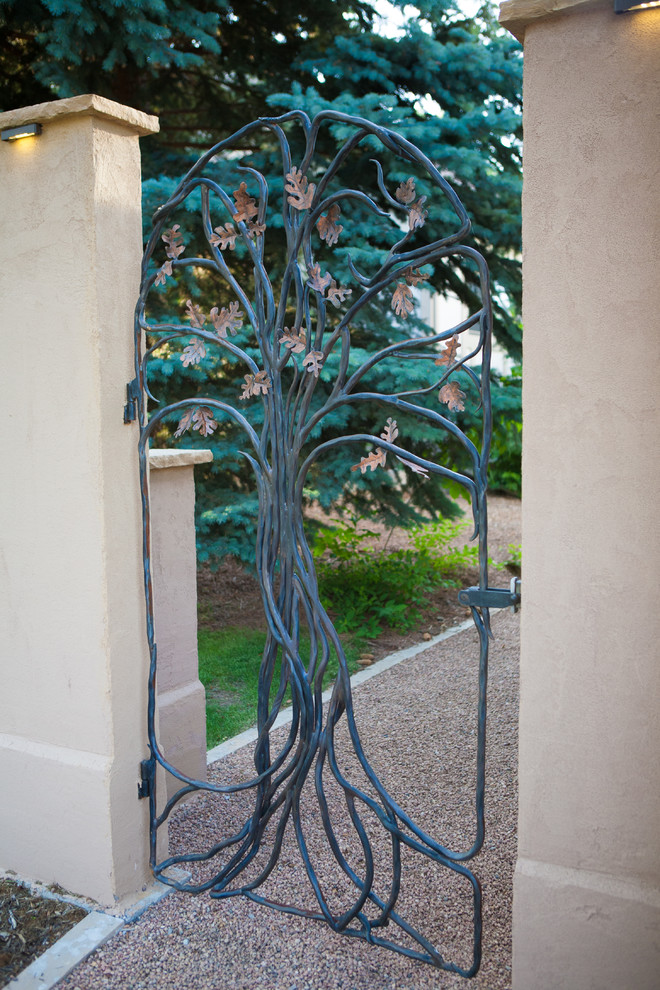 Iron Gate Designs Landscape Traditional with Beige Stucco Wall Gravel