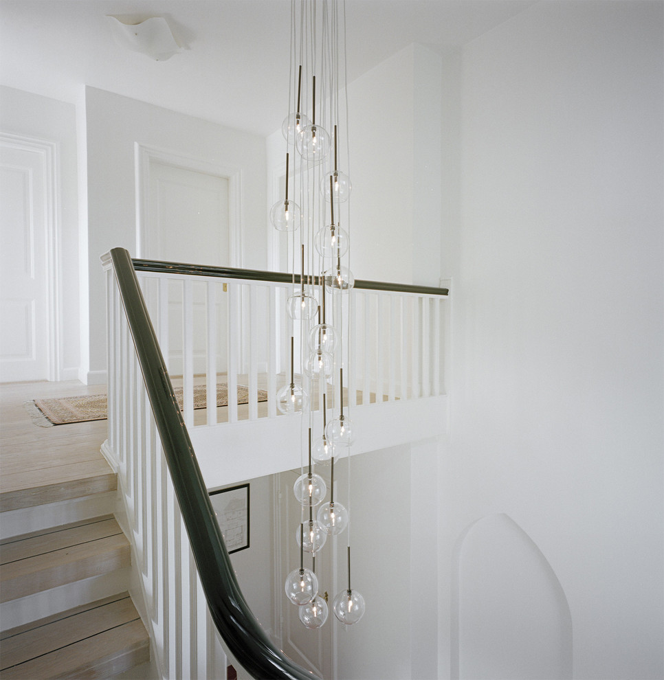 Light Wood Flooring Staircase Transitional with Black Handrail Bubble Light