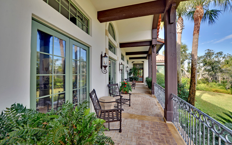 metal porch railing Porch Mediterranean with arched window beige stucco