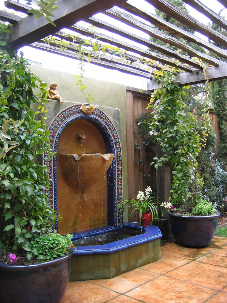 Modern Outdoor Fountains Patio Mediterranean with Accent Tiles Acid Stained Concrete1