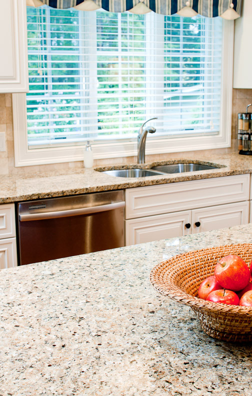 New Venetian Gold Granite Countertops Spaces Traditional with Cream Cabinets Granite Granite