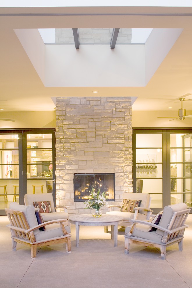 Outdoor Gas Fireplace Patio Contemporary with Armchairs Concrete Exterior Skylight