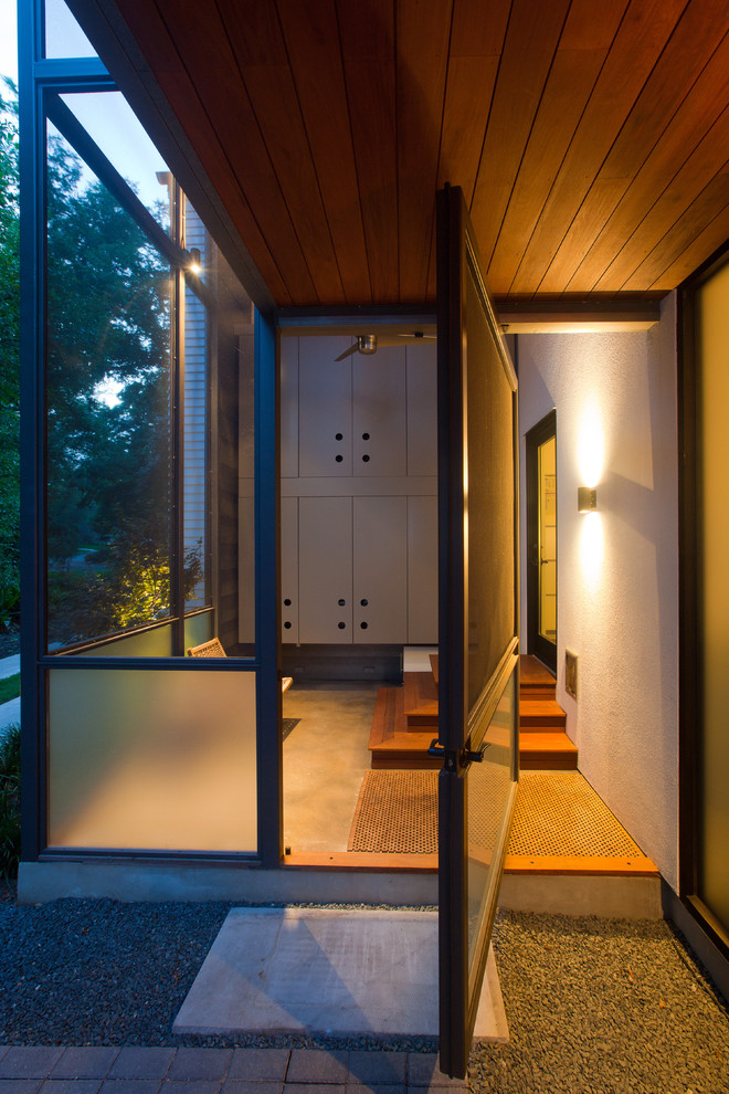 Pivot Closet Doors Porch Modern with Ceiling Fan Concrete Floor