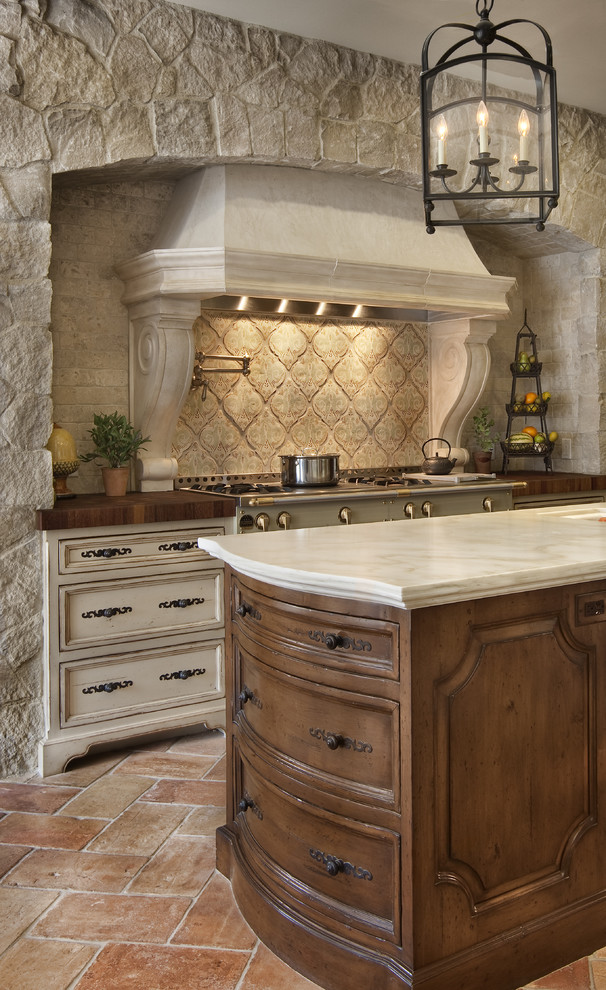 Raised Panel Cabinets Kitchen Mediterranean with Accent Tile Butcher Block