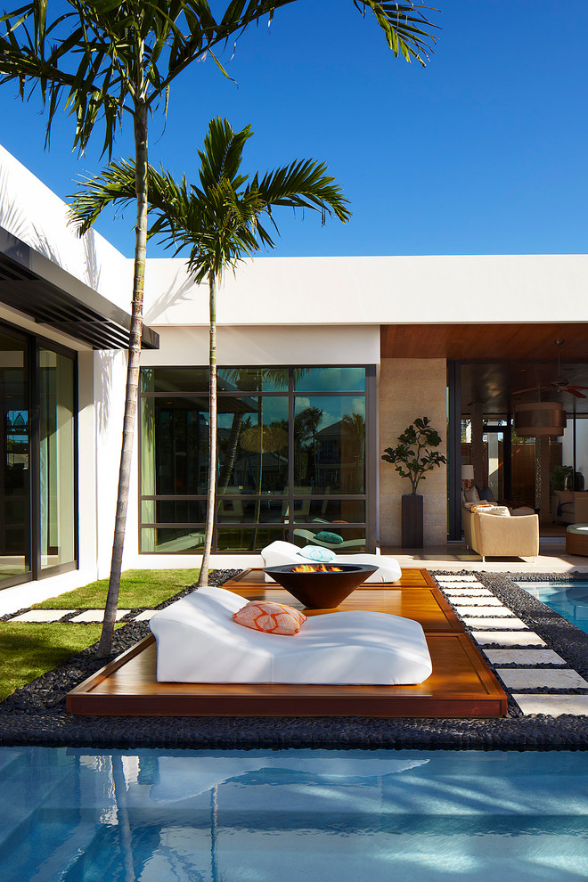 River Stone Tile Patio Tropical with Fire Pit Palm Trees