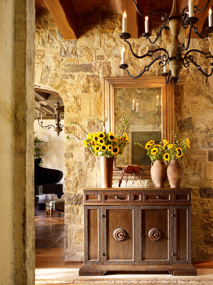 Stone Console Tables Entry Mediterranean with Area Rug Chandelier Exposed