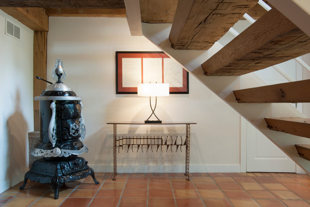 Terra Cotta Tile Hall Farmhouse with Barn Conversion Custom Cabinetry1