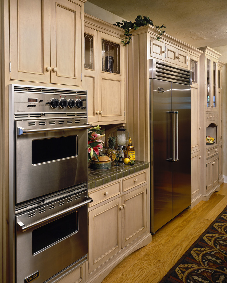 Tiled Countertops in Kitchen Kitchen Traditional with Applied Molding Beadboard Cabinet