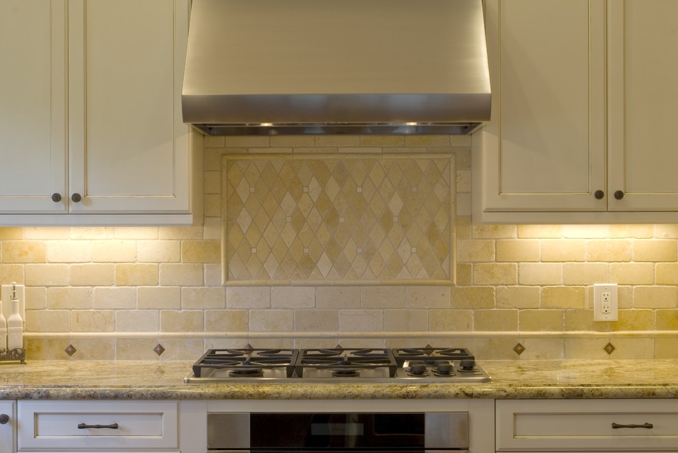 travertine kitchen backsplash Kitchen Traditional with decorative tiles range hood