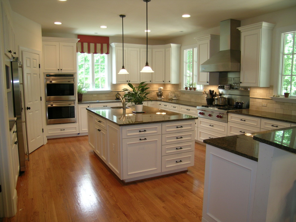 Tumbled Marble Subway Tile Kitchen Traditional with 36 Wolf Cooktop Casement