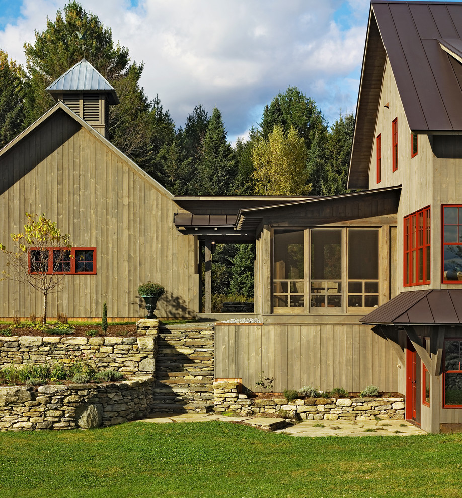 Vertical Wood Siding Exterior Farmhouse with Bark Chips Covered Entry