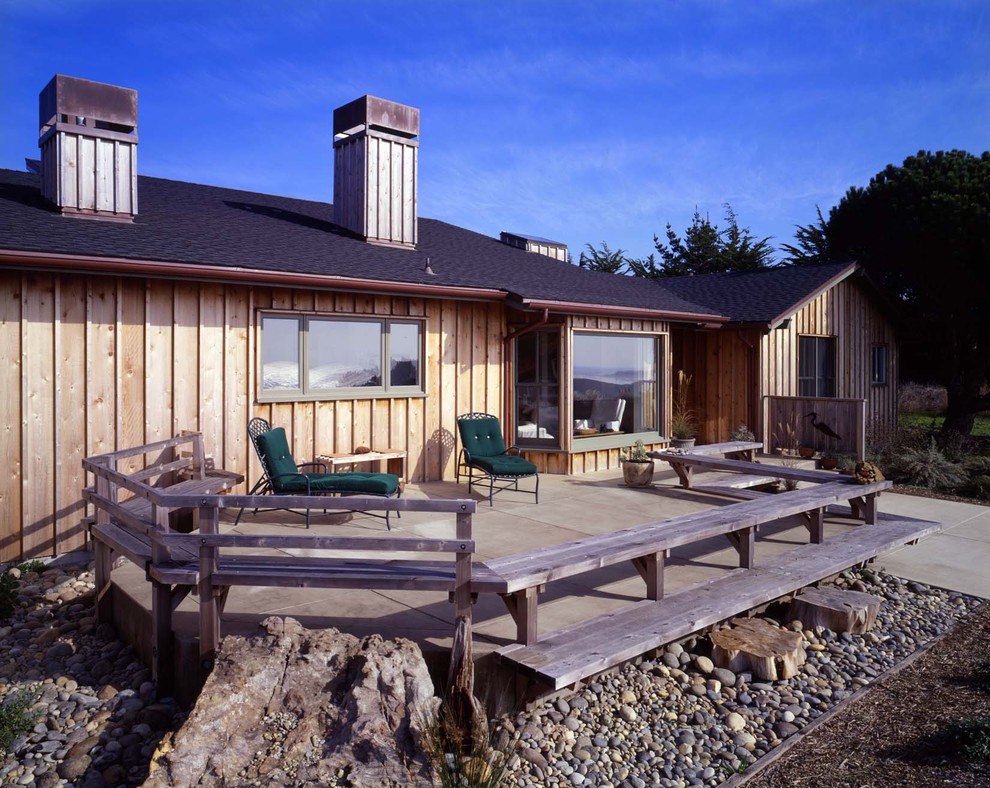 Vertical Wood Siding Exterior Rustic with Asphalt Shingle Roofing Bay