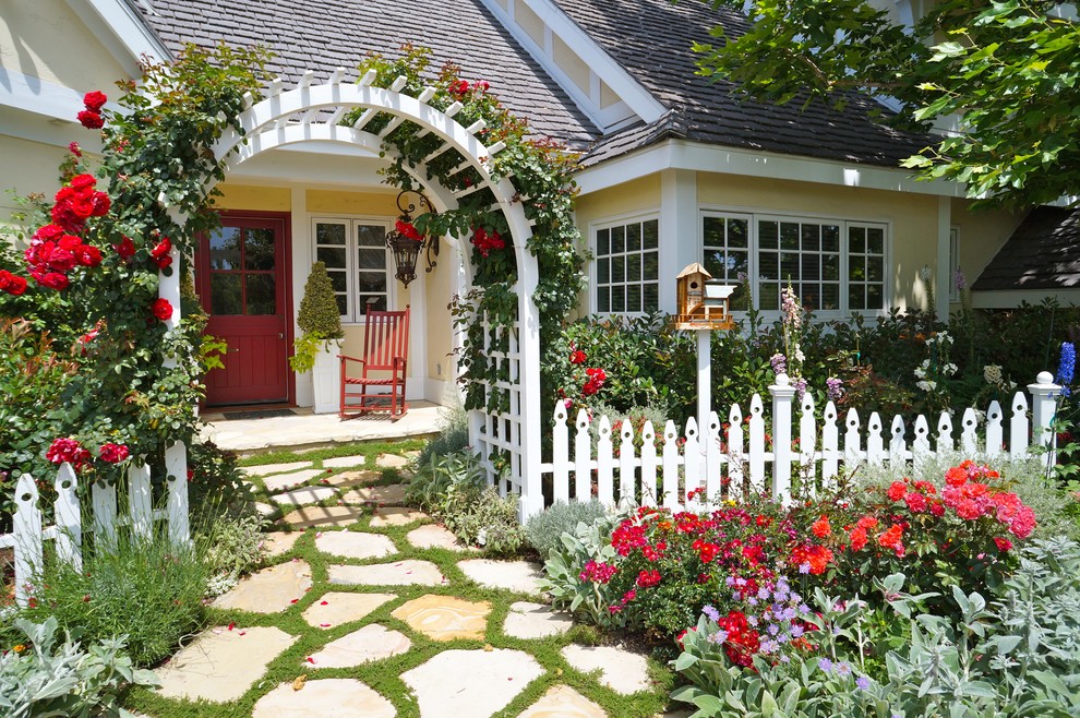 White Picket Fences Landscape Traditional with Arbor Birdhouses Brick Driveway