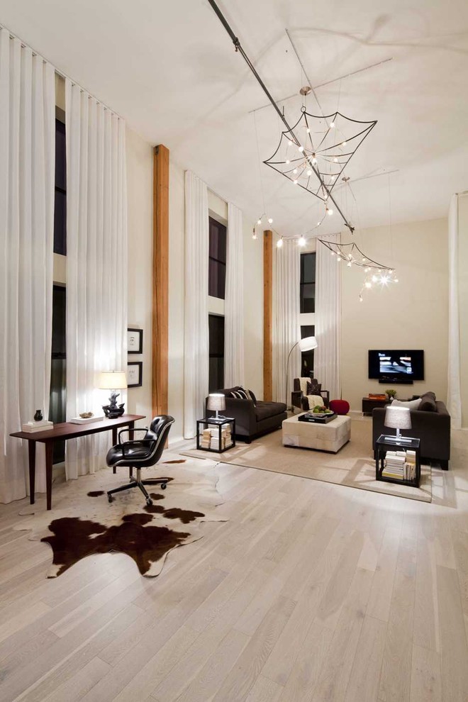 White Washed Wood Floors Living Room Eclectic with Accent Columns Cowhide Rug