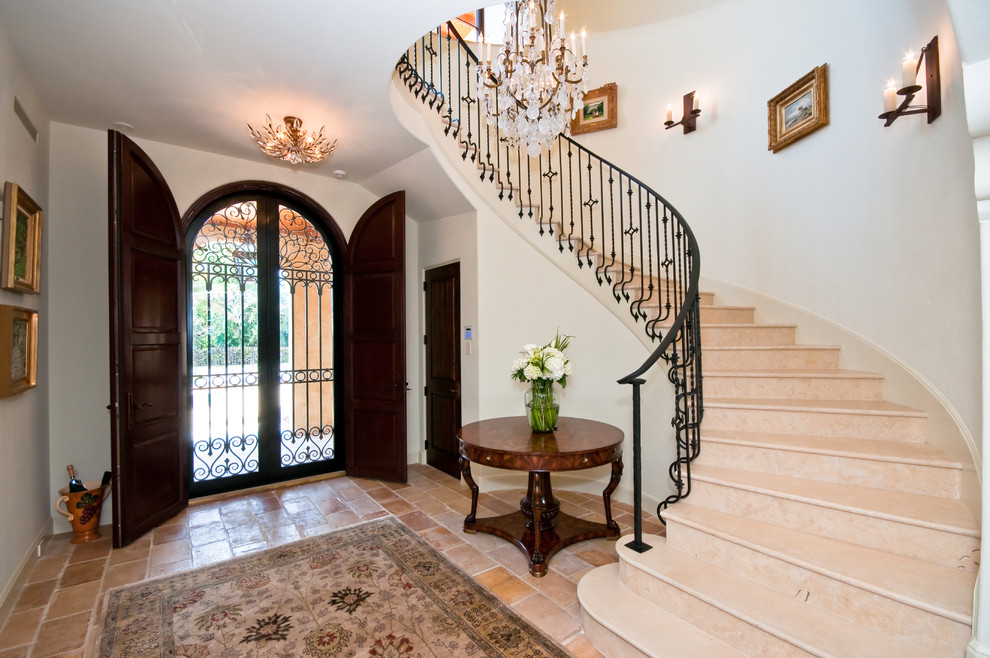 Wrought Iron Stair Railings Entry Mediterranean with Arched Front Door Beige