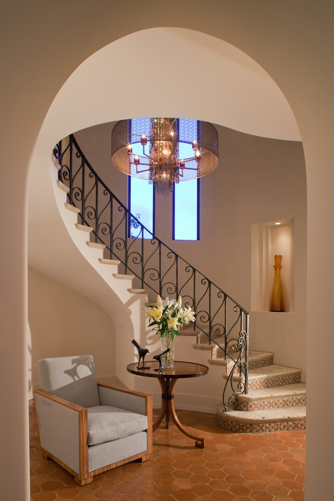 Wrought Iron Stair Railings Staircase Mediterranean with Beige Wall Chandelier Curved