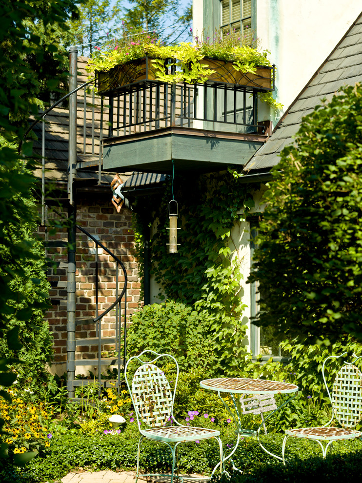 Wrought Iron Staircase Landscape Traditional with Bird Feeder Brick Exterior1