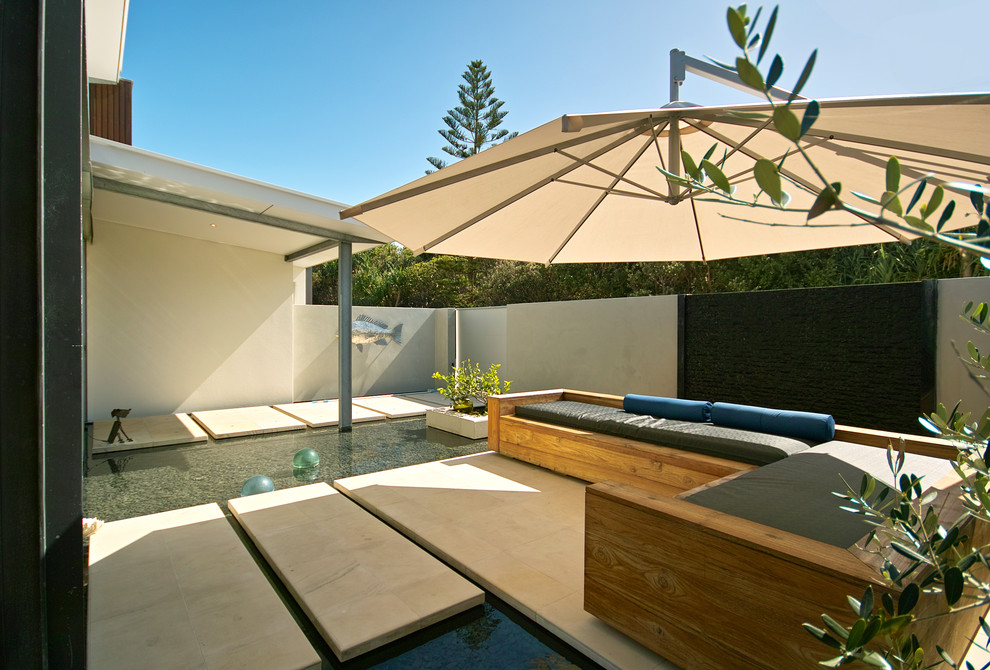 Cantilever Umbrella for Beach Style Patio with Concrete Stepping Stones