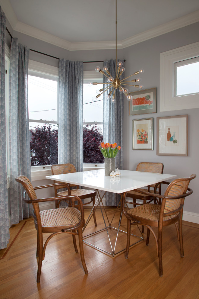Rattan Dining Chairs for Transitional Dining Room with Blue Curtains