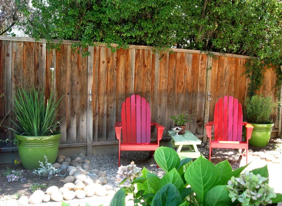 Adirondack Chairs for Eclectic Landscape with Wood Fence