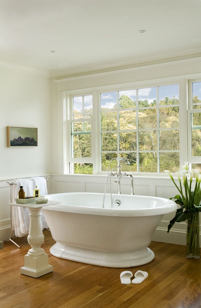 Kohler Freestanding Tub Faucet with Traditional Bathroom Wood Floor