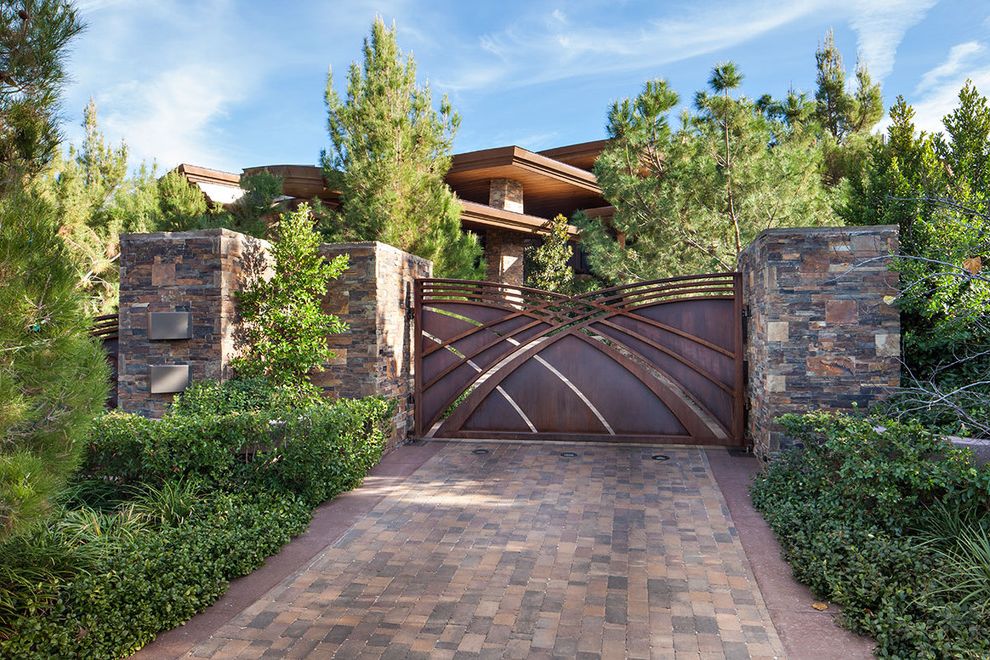 Modern Metal Gate Designs with Contemporary Landscape Stone Columns