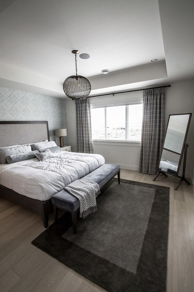 Joss and Main Area Rugs Transitional Bedroom with Medium Wood Floors