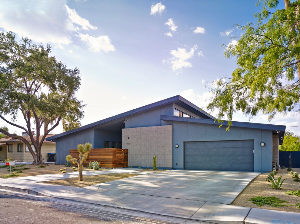 Primary Care of the Andovers Midcentury Exterior with Garage Door