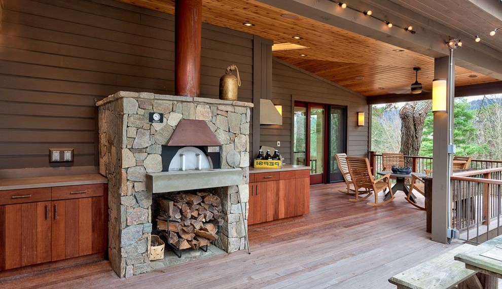 Backyard Pizza Oven Farmhouse Porch with Wall Sconce