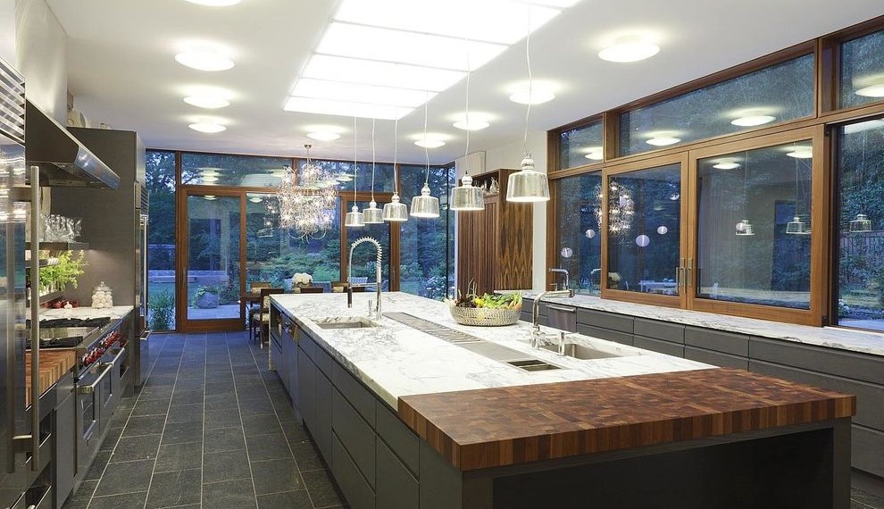 Butcher Block Tops Contemporary Kitchen with Three Ovens